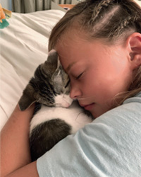 Girl With Her Adopted Cat